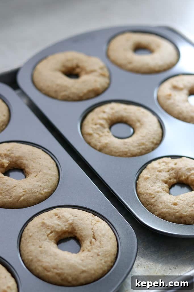 Baked apple donuts in a donut pan