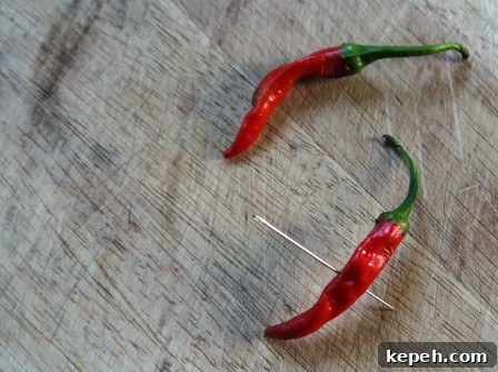 Piercing chilli peppers for Chilli Hot Chocolate