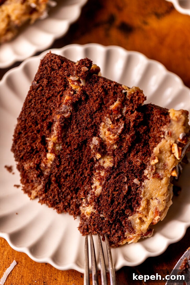 Authentic German Chocolate Cake Recipe for Decadent Dessert 3 Slice of german chocolate cake on a plate.