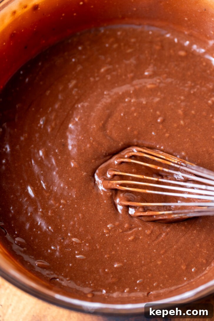 Authentic German Chocolate Cake Recipe for Decadent Dessert 5 Chocolate cake batter in a bowl.