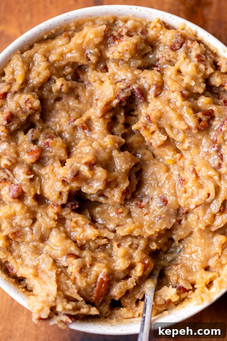 Authentic German Chocolate Cake Recipe for Decadent Dessert 8 Coconut pecan frosting in a bowl.