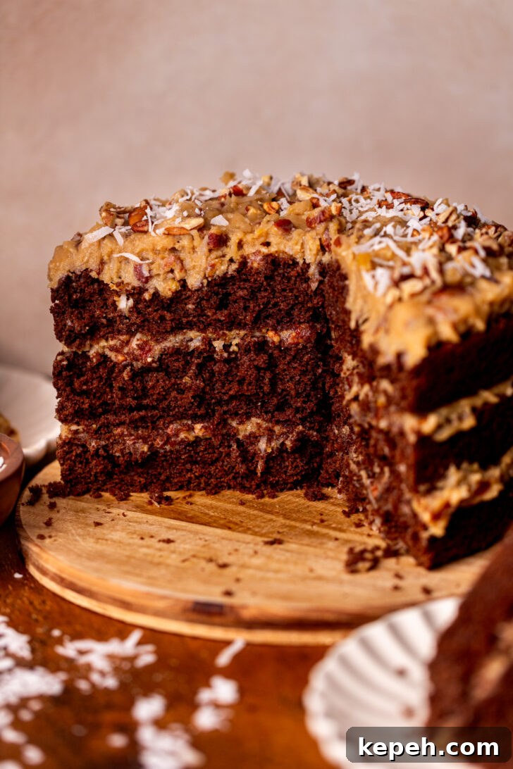 Authentic German Chocolate Cake Recipe for Decadent Dessert 10 German chocolate cake on a wood board.