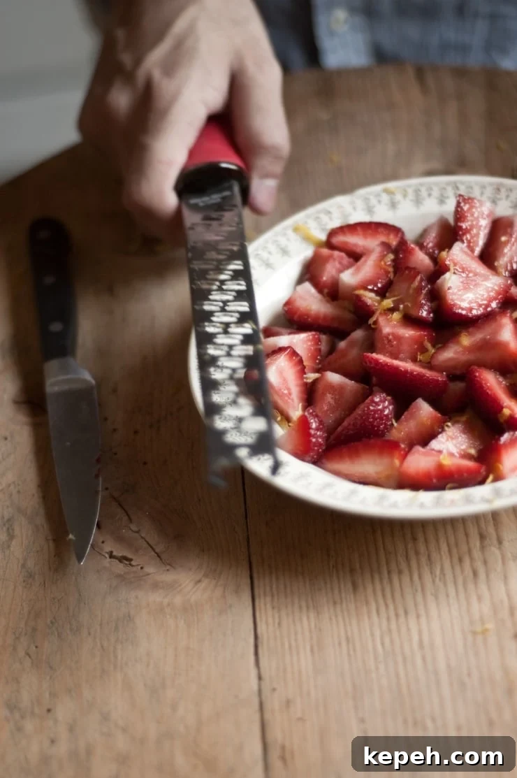 Strawberry Vanilla Swirl Ice Cream Recipe — Creamy Homemade Dessert 8 A delightful vanilla ice cream recipe swirled with homemade strawberry sauce. | sophisticatedgourmet.com