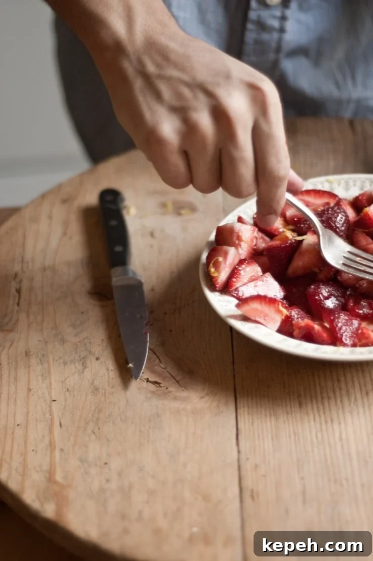 Strawberry Vanilla Swirl Ice Cream Recipe — Creamy Homemade Dessert 9 A delightful vanilla ice cream recipe swirled with homemade strawberry sauce. | sophisticatedgourmet.com