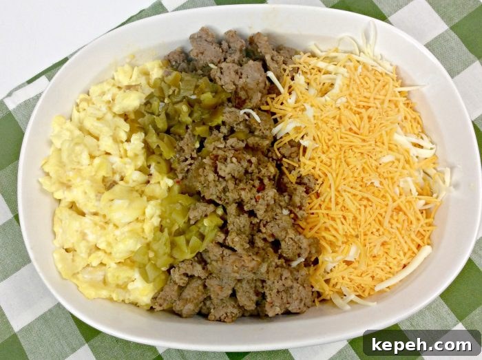 eggs, chorizo, and cheese on a plate.