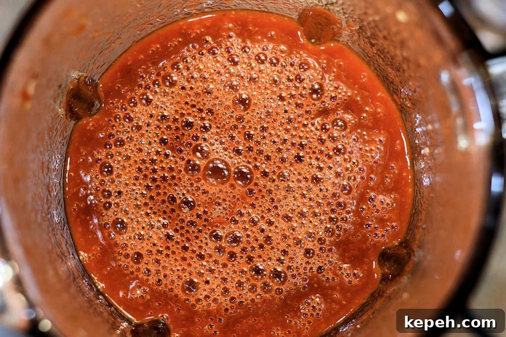 Authentic Red Tamale Sauce Recipe with Video Guide 6 24Bite: Homemade Tamale Sauce in an electric blender