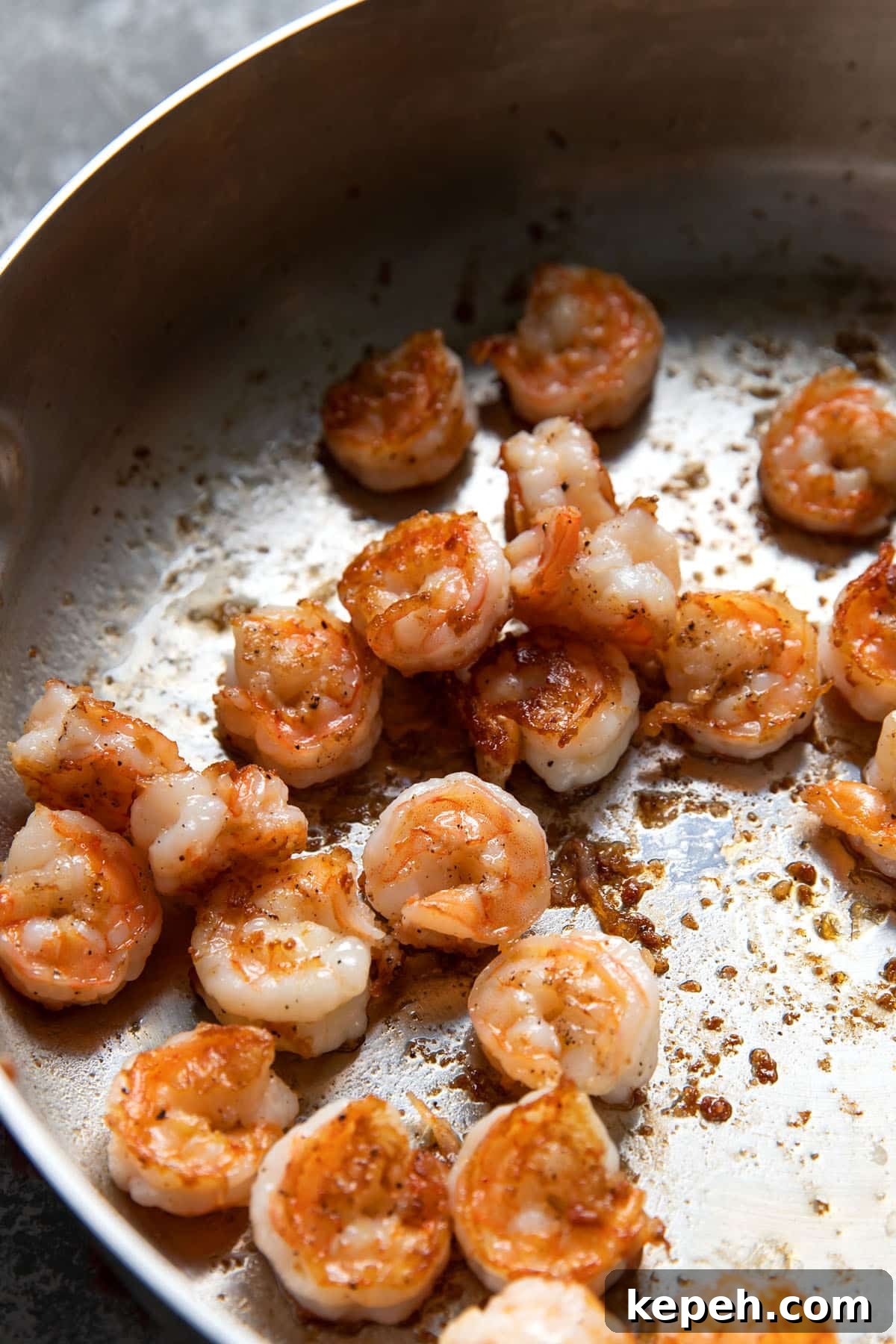Creamy Summer Shrimp Pasta Recipe for Light, Zesty Meals 4 cooked shrimp in a pan