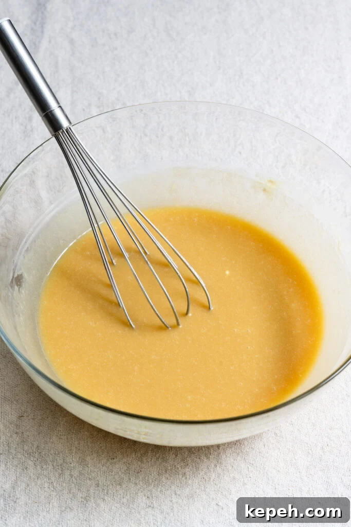 Whisk in a bowl of sugar, creme fraiche, and eggs.