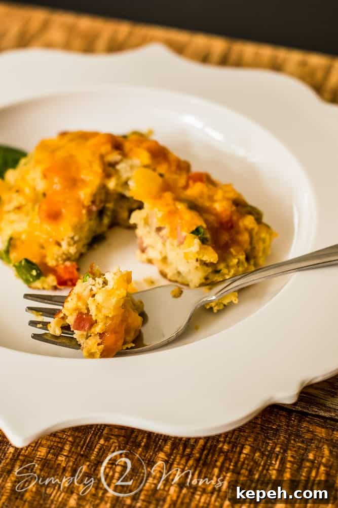 a keto southwest breakfast biscuit with a fork on a scalloped plate