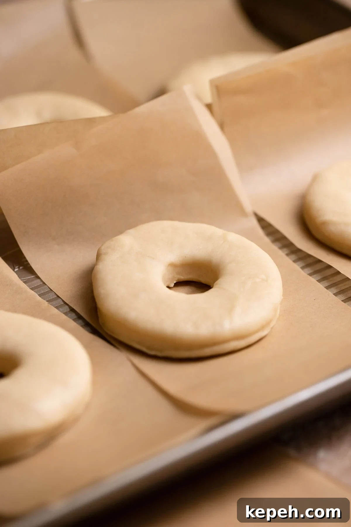 Salted Caramel Donuts with Shiny Caramel Glaze 7 Donuts on individual parchment squares before they double in size.