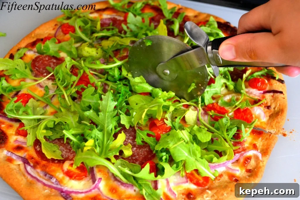 Soppressata Pizza - Cutting a Slice With Pizza Cutter