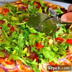 Soppressata Pizza - Cutting a Slice With Pizza Cutter