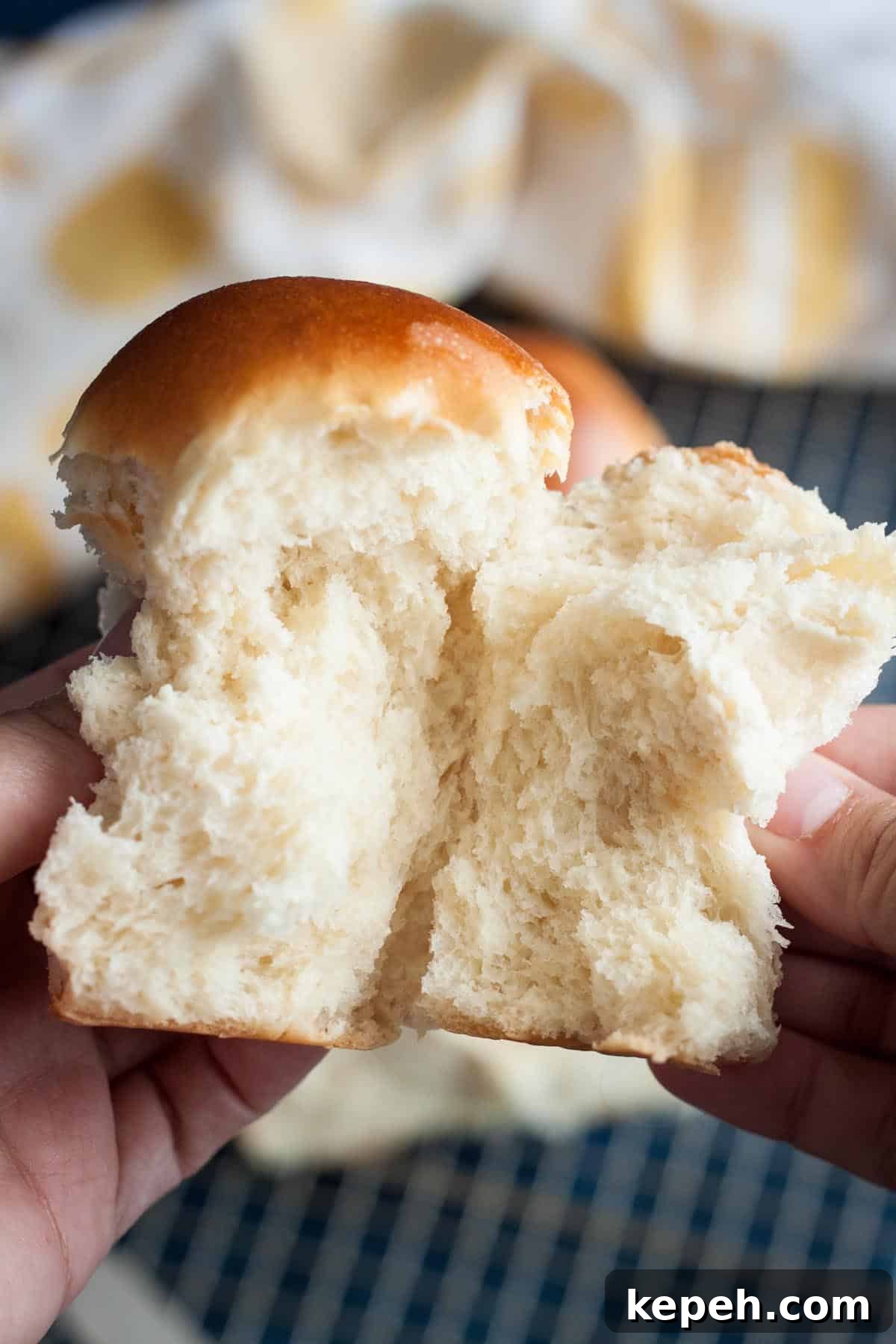 A piece of milk bread being pulled apart. A piece of milk bread being pulled apart.