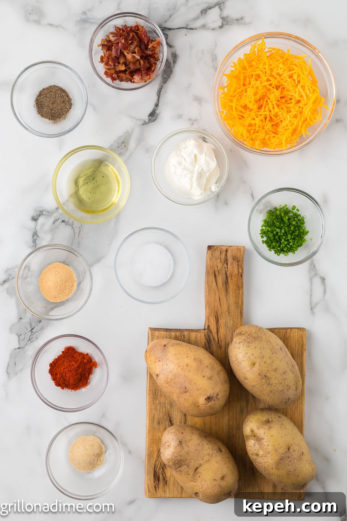 Smoked Hasselback Potatoes with Crispy Herb Butter 3 ingredients for Hasselback Potatoes - potatoes, olive oil, smoked paprika, garlic powder, onion powder, salt, pepper, cheese, bacon, chives, sour cream