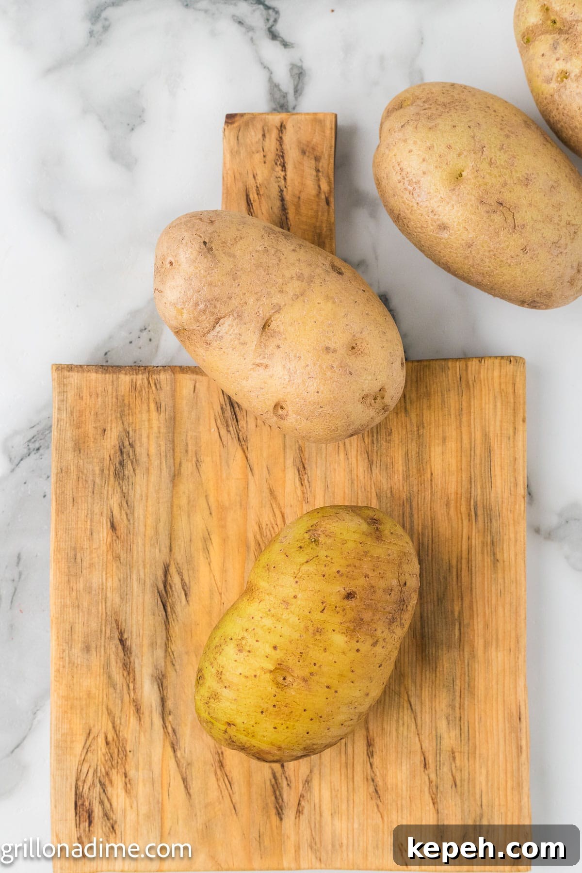 Smoked Hasselback Potatoes with Crispy Herb Butter 4 Bake potatoes on a cutting board