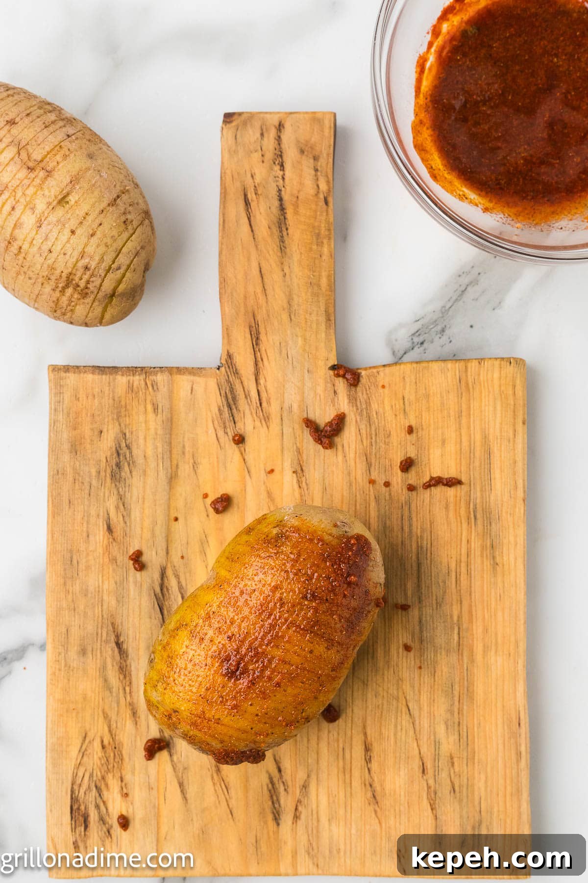 Smoked Hasselback Potatoes with Crispy Herb Butter 6 Rubbing the seasoning mixture over the potatoes