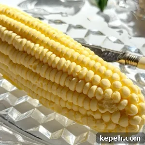 Miso-Honey Corn Compound Butter Recipe for Grilled Corn 9 Extreme close up of the high-definition kernel texture on a sweet corn compound butter centerpiece.