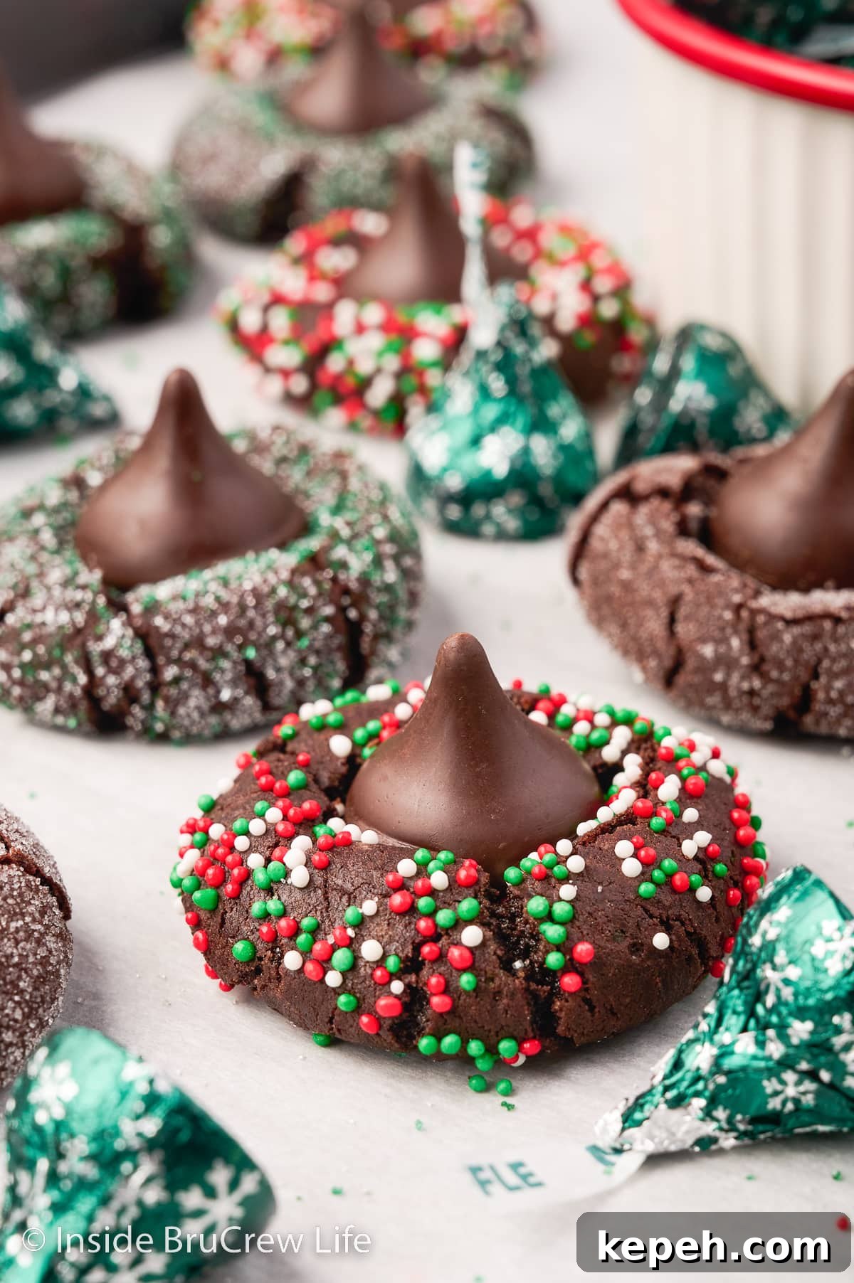 Chocolate sprinkle cookies topped with chocolate kisses.