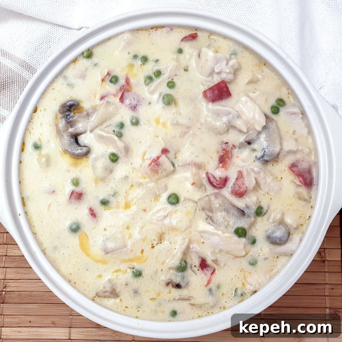 Classic Chicken à la King Recipe: Creamy One-Pot Dinner 14 Chicken a la king in a white serving dish.