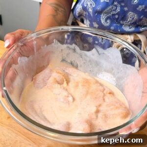 Crispy Southern Fried Catfish Recipe with Tangy Remoulade 4 Catfish soaking in buttermilk.