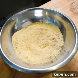 Crispy Southern Fried Catfish Recipe with Tangy Remoulade 5 Cornmeal in a bowl with seasonings mixed in.