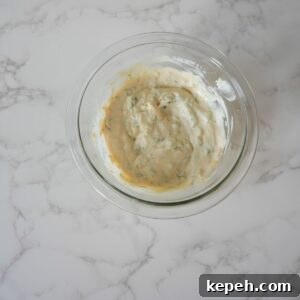 Crispy Southern Fried Catfish Recipe with Tangy Remoulade 6 Tartar sauce in a glass bowl.
