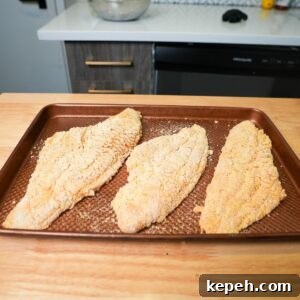 Crispy Southern Fried Catfish Recipe with Tangy Remoulade 7 Catfish with breading before being fried.