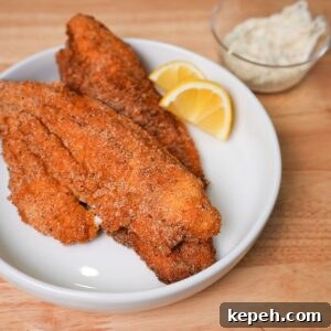 Crispy Southern Fried Catfish Recipe with Tangy Remoulade 10 Golden crispy fried catfish on a plate.