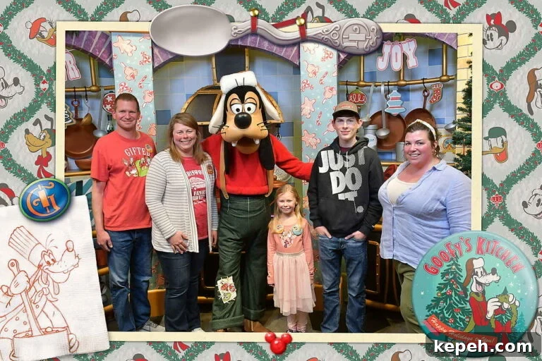Professional Disney memory maker photo with Goofy at Goofy's Kitchen entrance with a holiday theme.