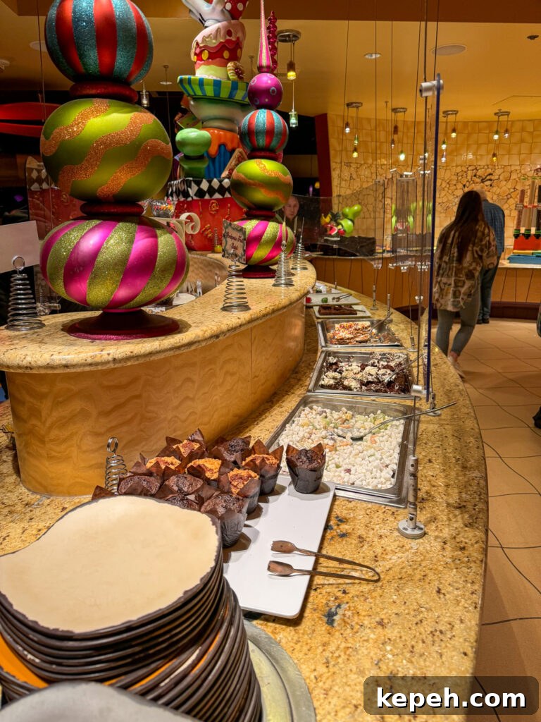 Large pans of assorted desserts on the buffet line in a Goofy's Kitchen Review.