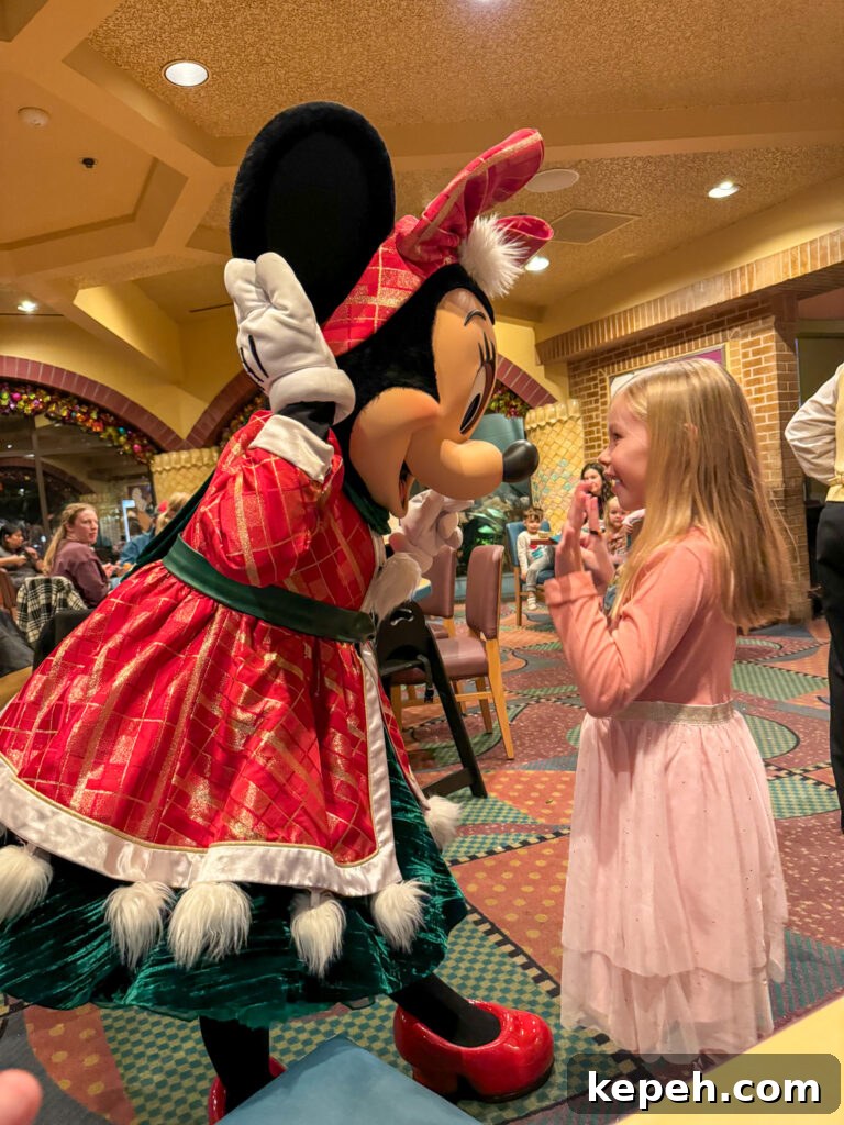Minnie Mouse is one of the characters greeting a guest at Goofy's Kitchen.
