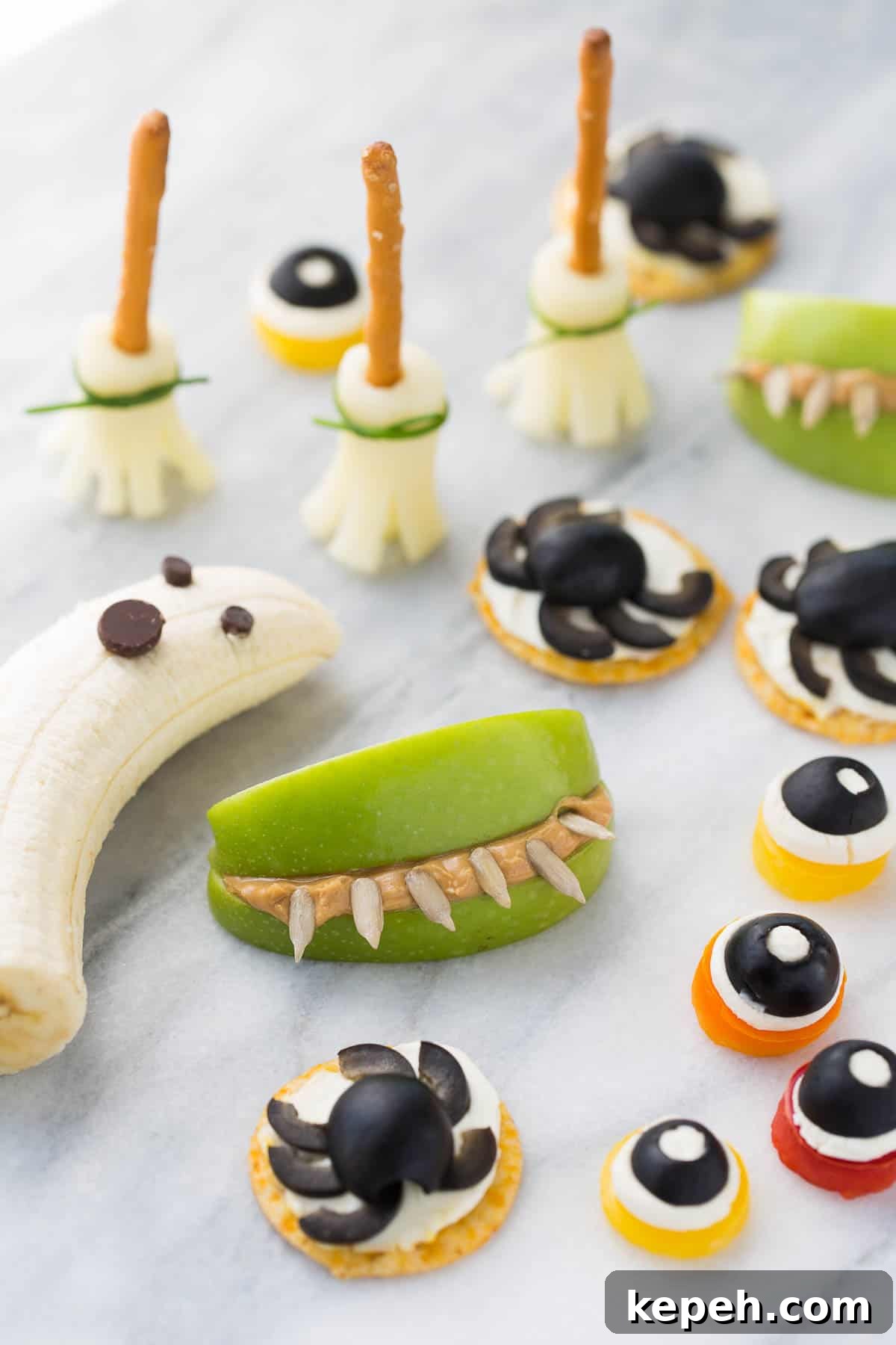 Spooky Halloween Snack Mix Recipes for Party Treats 11 healthy halloween snacks on white marble background
