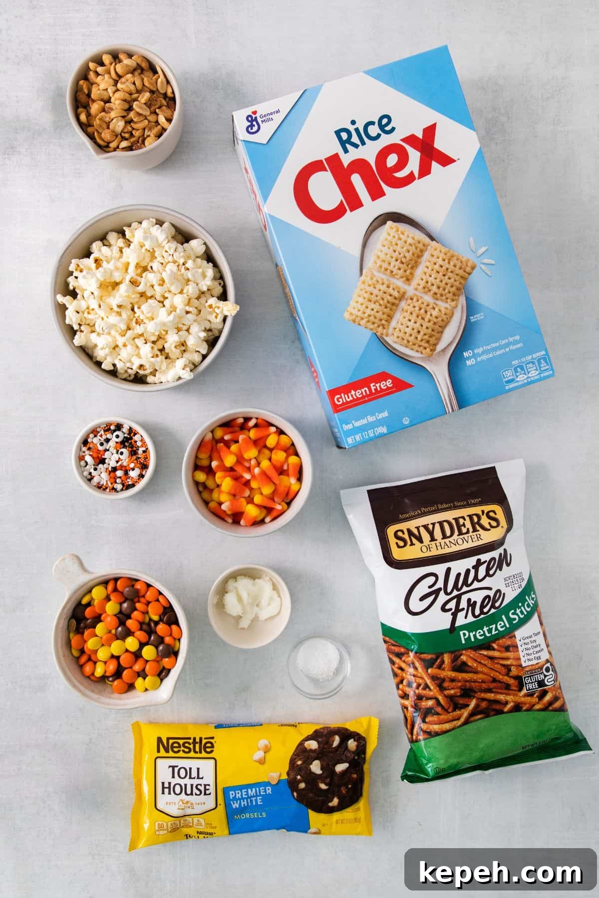 Spooky Halloween Snack Mix Recipes for Party Treats 3 Halloween snack mix ingredients on a countertop