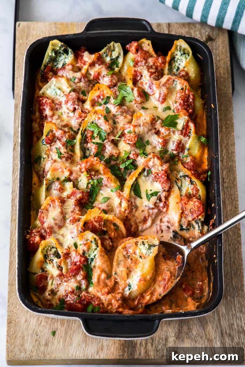 Top Easter Main Courses for a Memorable Holiday Meal 18 Dish of Spinach and Ricotta Pasta Shells, with a spoon.
