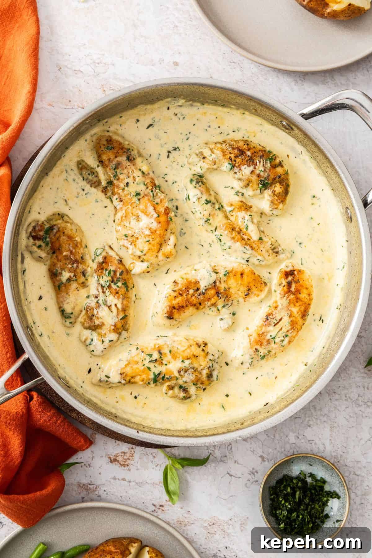 Top Easter Main Courses for a Memorable Holiday Meal 20 Large frying pan with Creamy Herb Chicken, ready to serve.