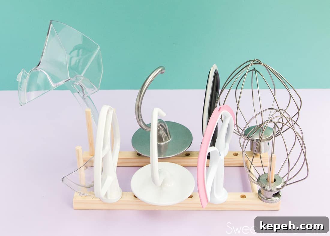 The stand mixer attachments perfectly organised on the DIY attachment holder.