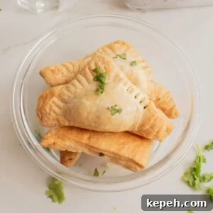 Authentic Jamaican Patty Recipe: Flaky Beef & Veggie Patties 11 Close-up of a bowl stacked with Jamaican black bean patties.