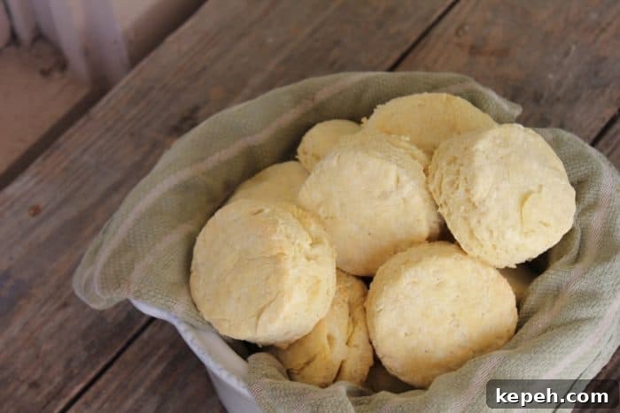 Image shows a basket of biscuits on a wooden table