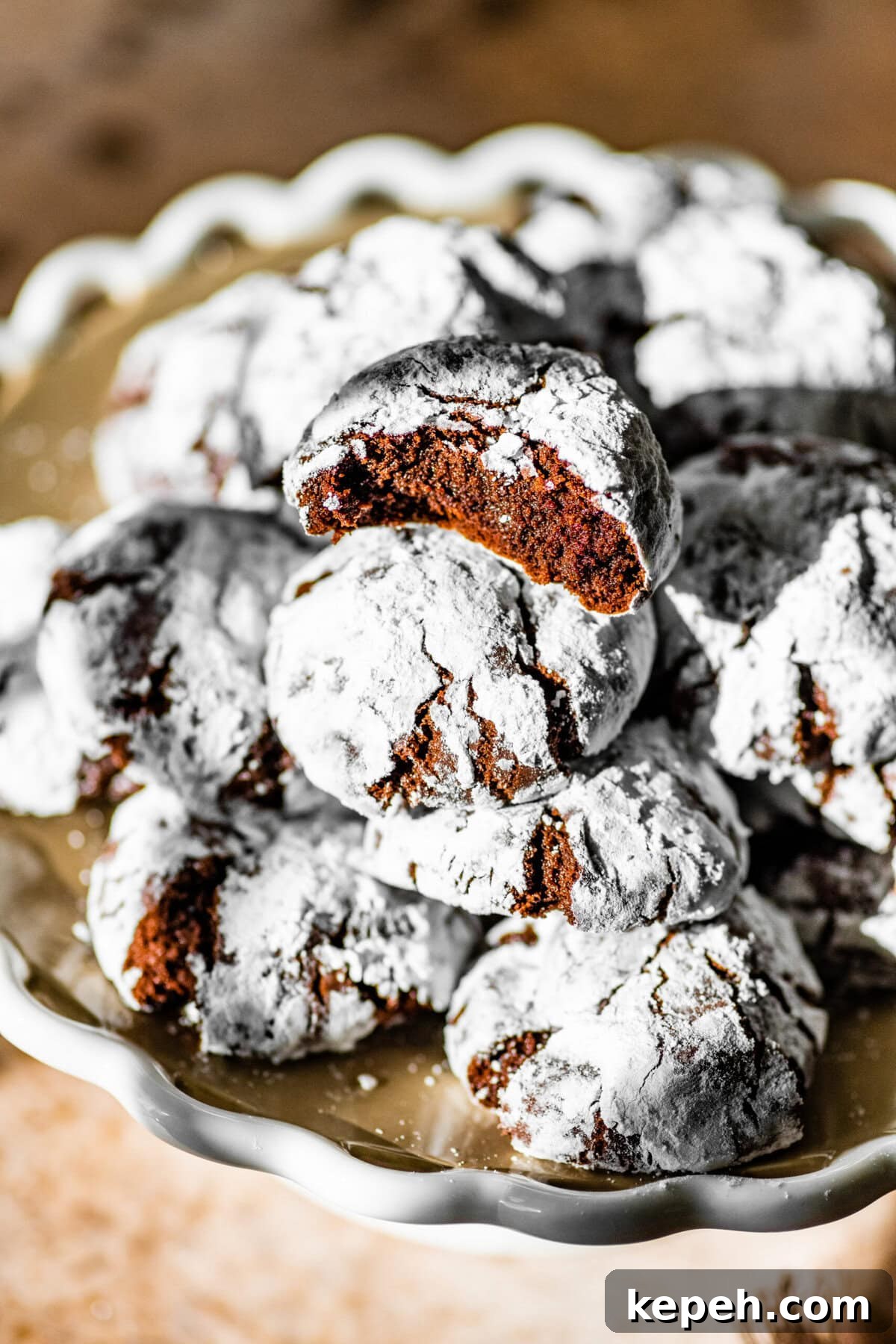Cookies on a platter with a bite taken out of one cookie.