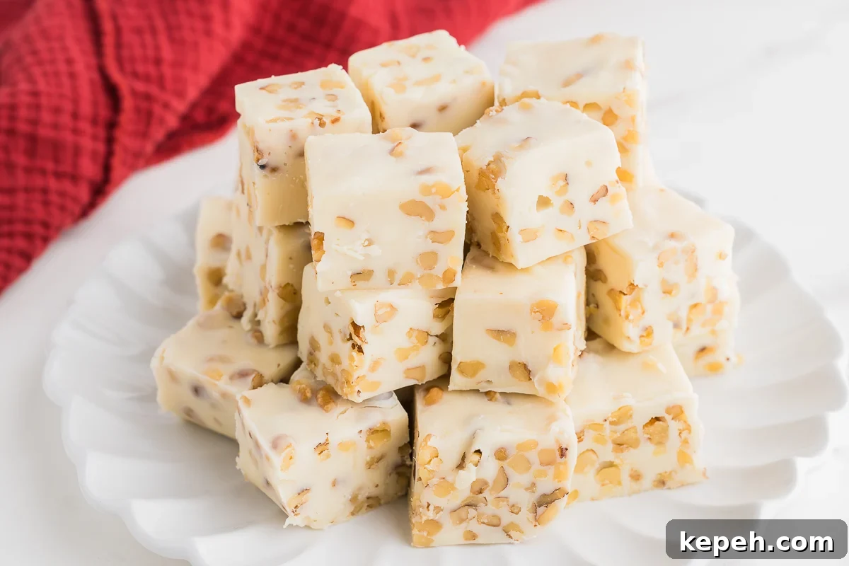 Maple Walnut Fudge Recipe: Rich Homemade Fudge with Pecans 7 fudge with nuts on a plate