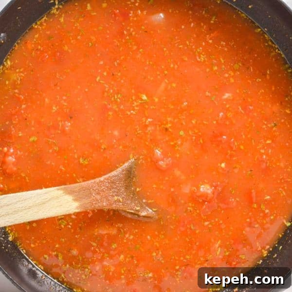 Hearty Red Lentil Chili with Smoky Tomatoes and Spices 6 Tomato sauce and herbs in a pan