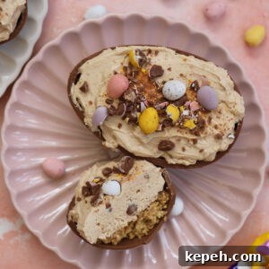 An Easter egg cheesecake on a pink plate.