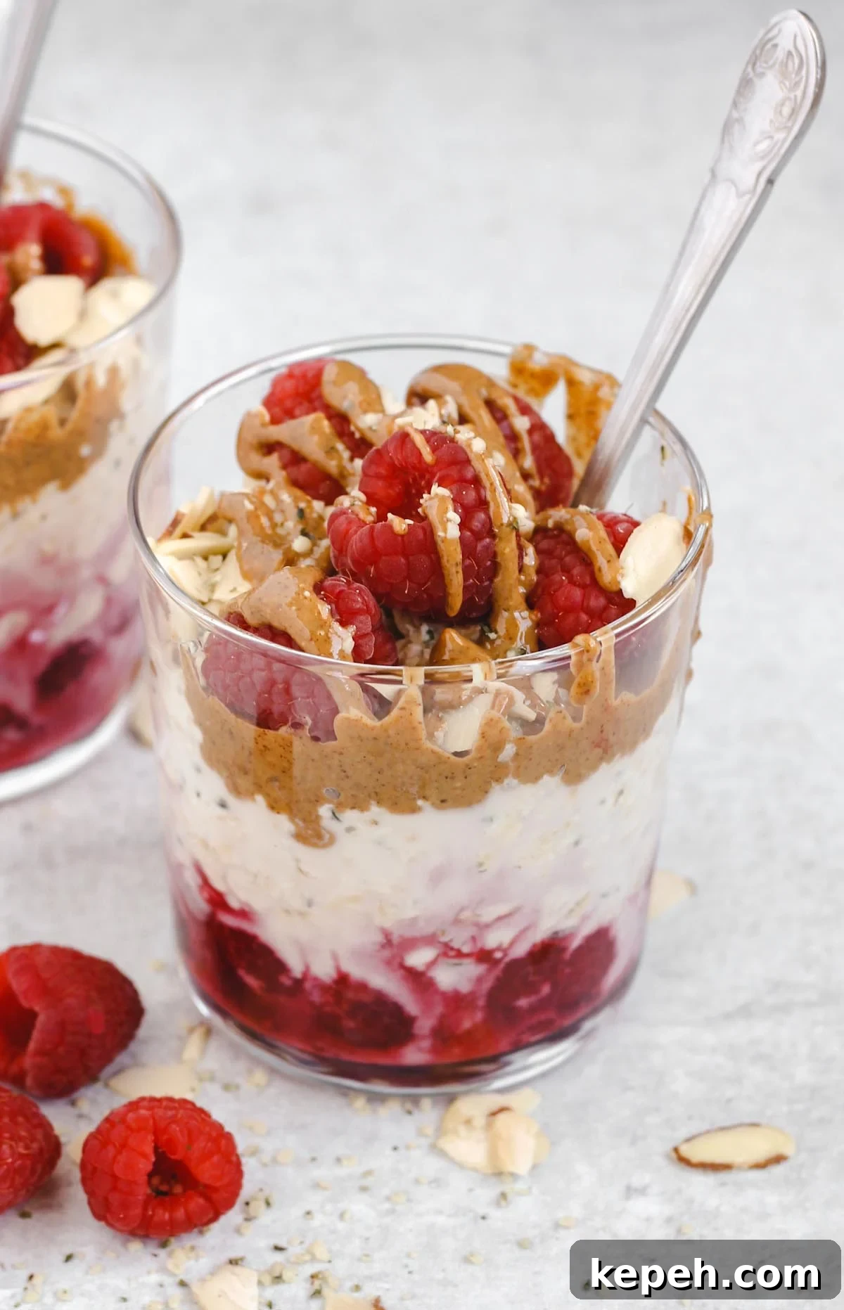 Creamy Raspberry Overnight Oats Recipe for Quick Breakfast 4 one glass of raspberry almond overnight oats with almond butter drizzled on top