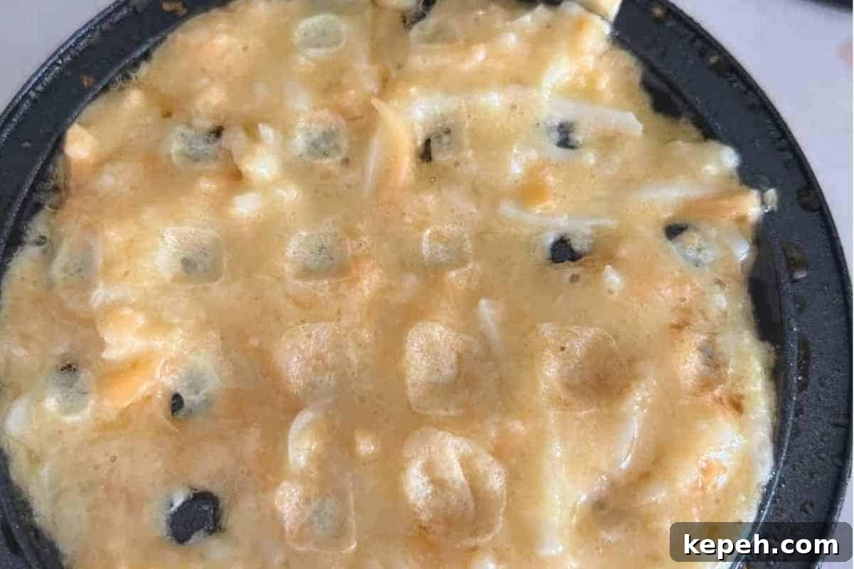 Savory Carnivore Waffles: High-Protein Breakfast Recipe 4 Waffle batter in a mini dash waffle maker.