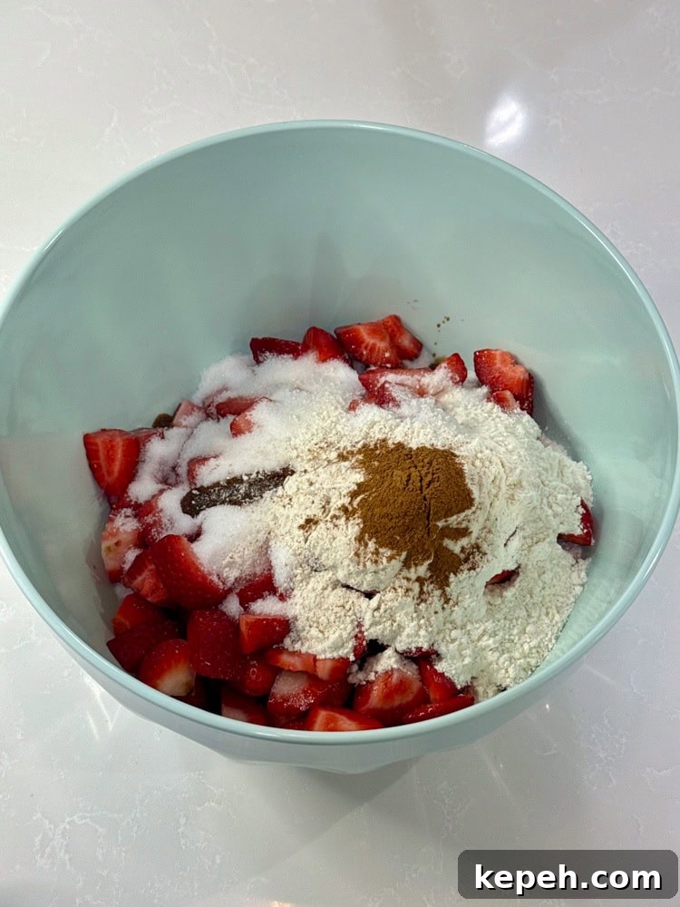 Strawberry Rhubarb Pie Recipe: Sweet-Tart Summer Dessert 10 diced rhubarb, sliced strawberries, sugar, flour, cinnamon, and vanilla extract in a bowl