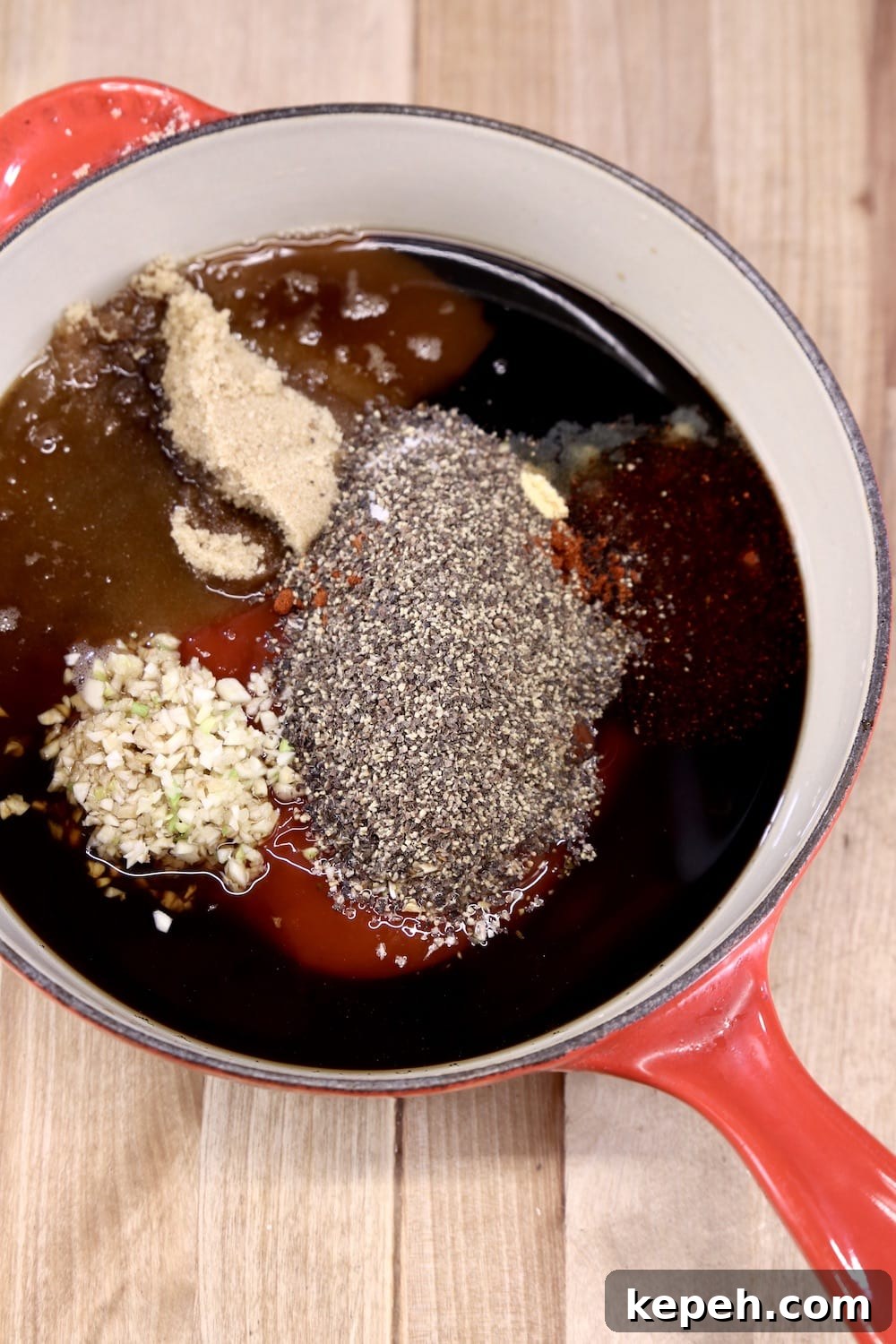 Barbecue Sauce ingredients in a red sauce pan
