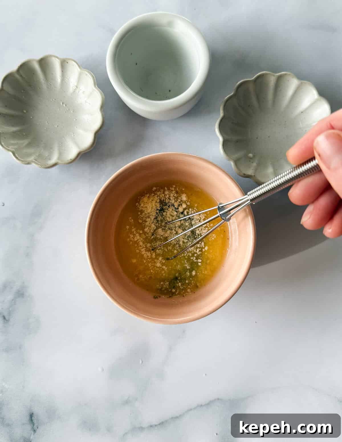 Garlic Butter Microwave Cauliflower Recipe for Quick Sides 9 a bowl of melted garlic parmesan butter.