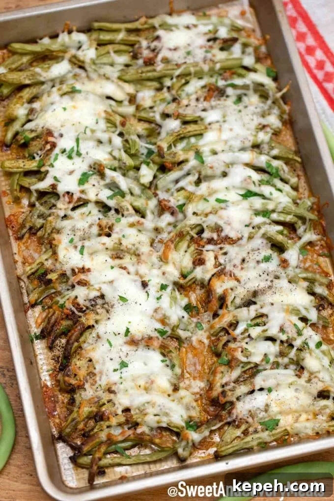 Cheesy Baked Green Beans Casserole with Garlic and Parmesan 5 cheesy baked green beans on a baking sheet
