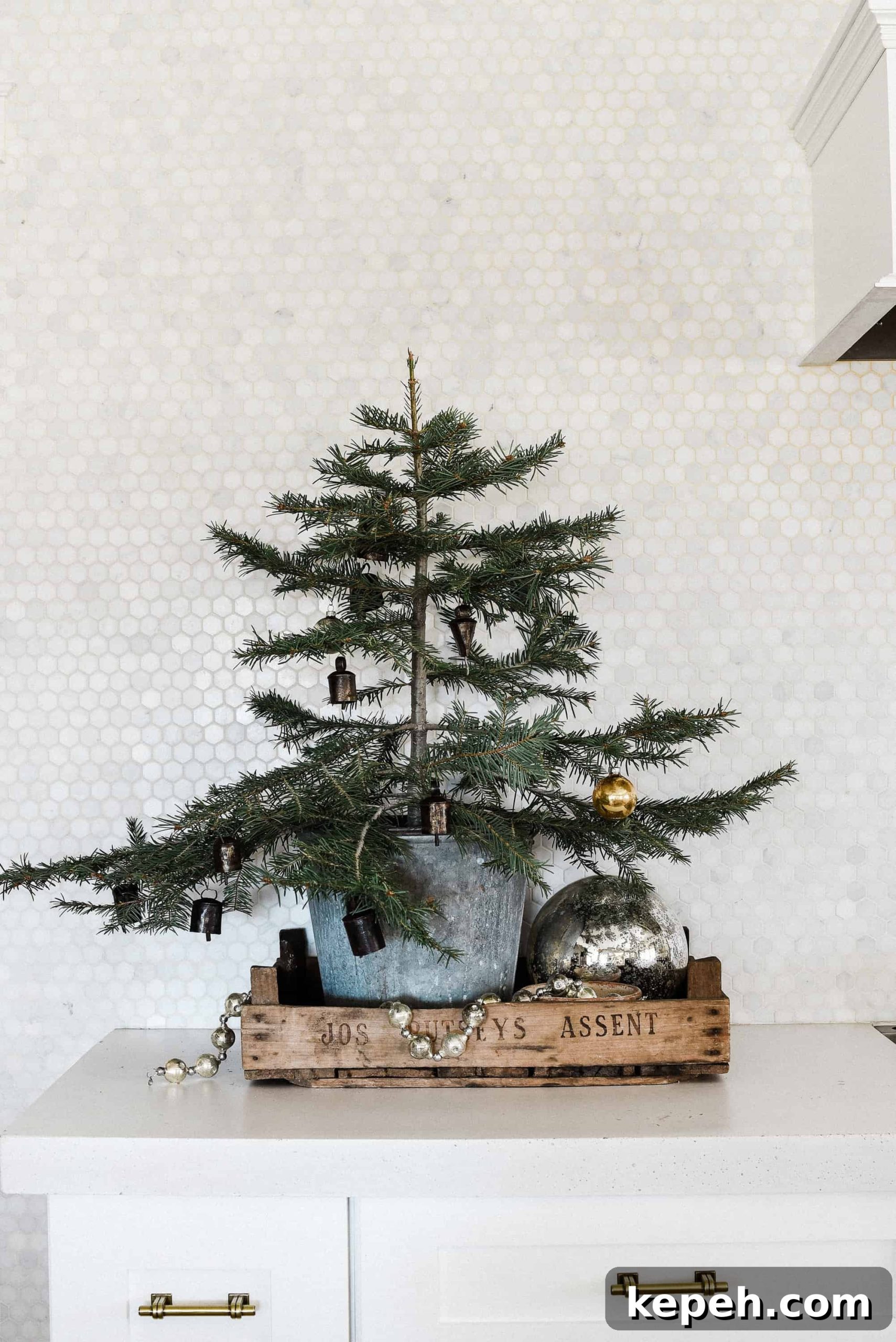 Farmhouse Christmas Kitchen Decorating Ideas for Cozy Holiday Charm 6 Tour our Christmas kitchen to gather ideas for decorating for the holidays this year! Use greenery and vintage touches to keep things simple and cohesive!