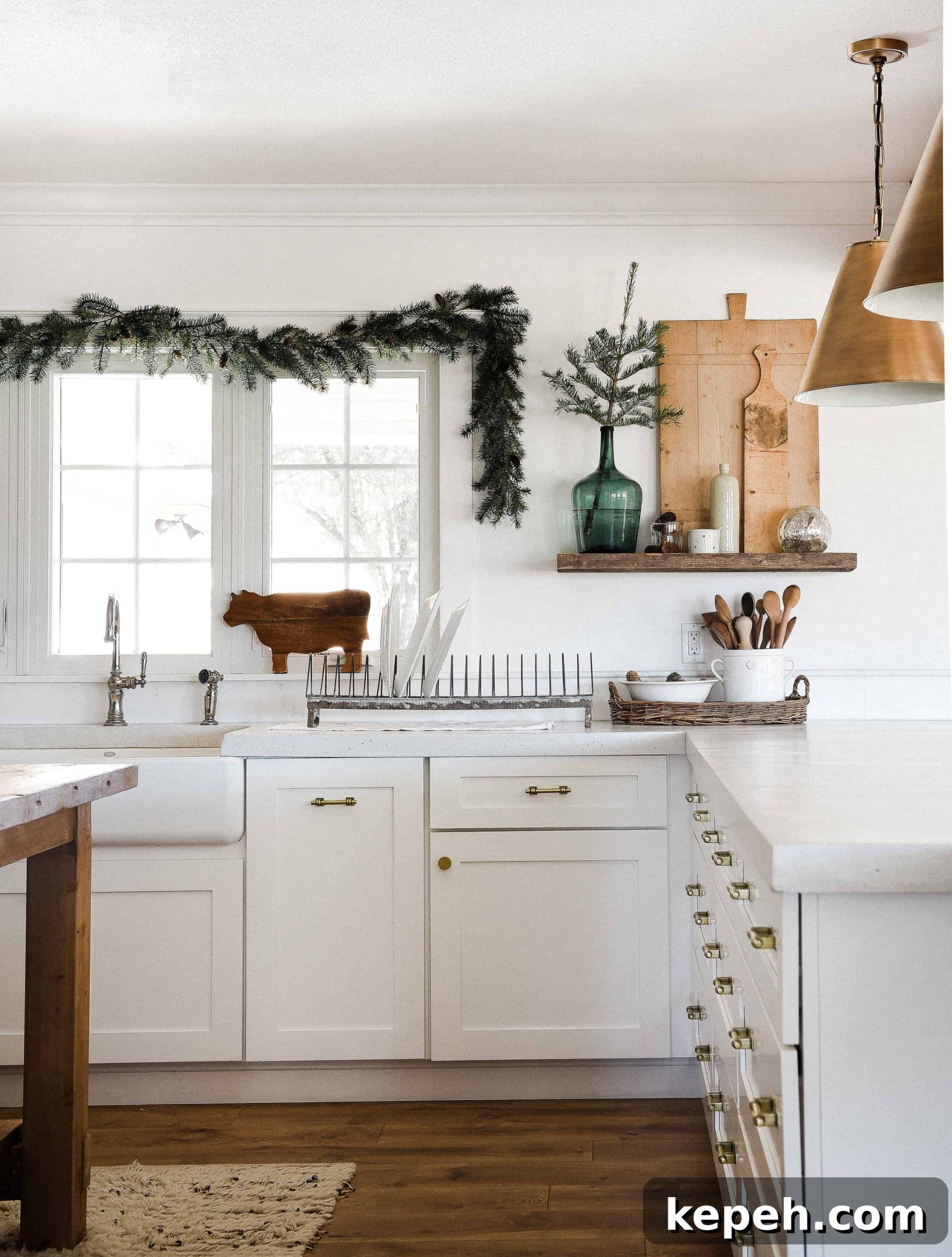 Farmhouse Christmas Kitchen Decorating Ideas for Cozy Holiday Charm 7 Tour our Christmas kitchen to gather ideas for decorating for the holidays this year! Use greenery and vintage touches to keep things simple and cohesive!